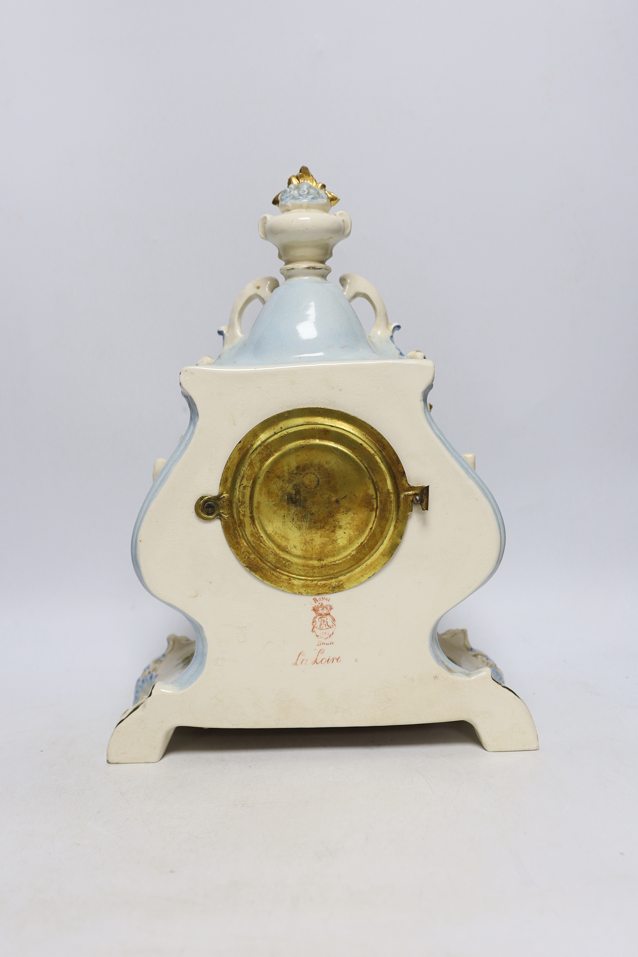 A Royal Bonn pottery mantel clock with Ansonia movement, striking on a coiled gong, 37cm high